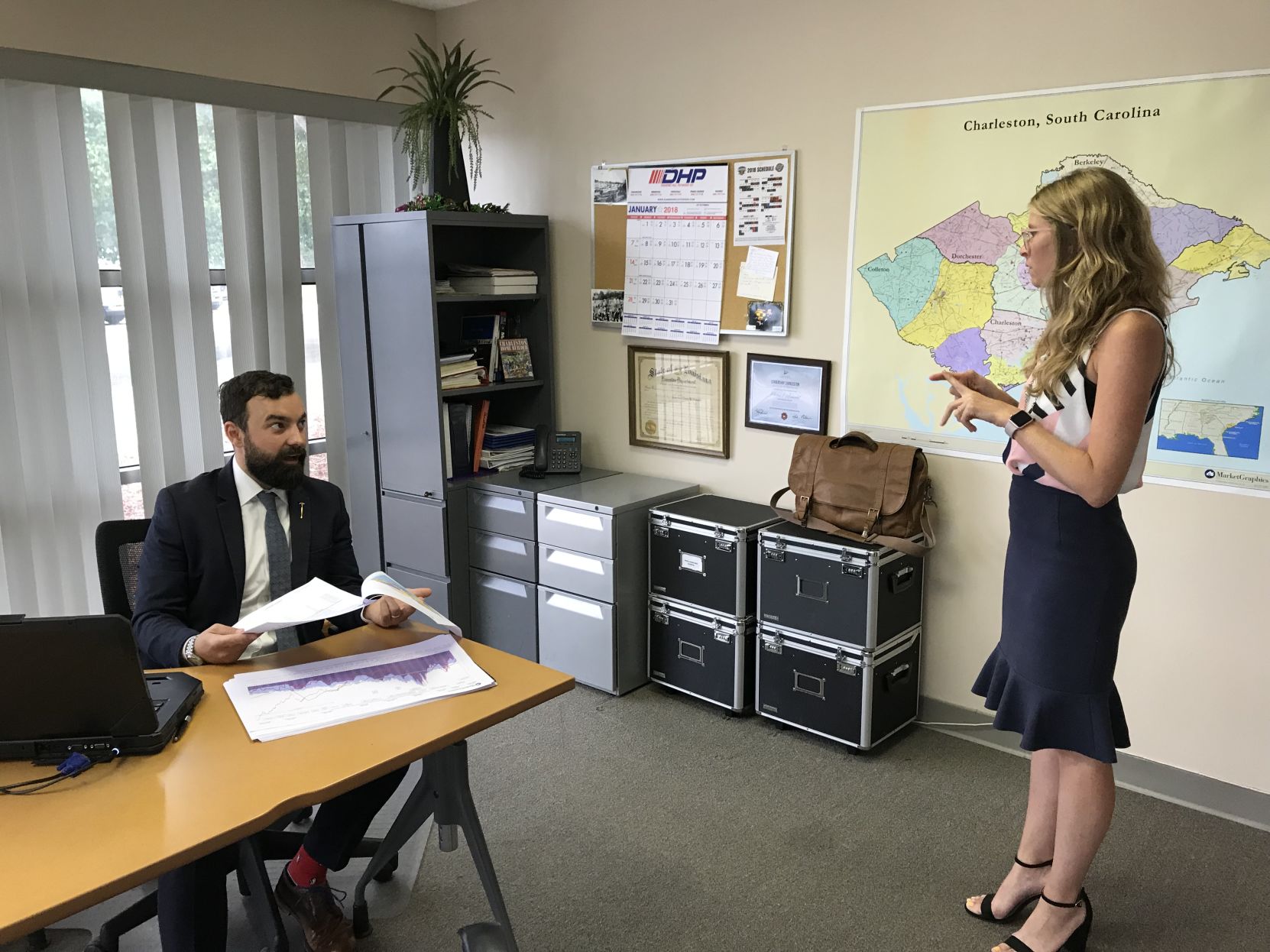 Patrick Arnold with assistant Ashley Valdivieso in Charleston Home Builders Association office